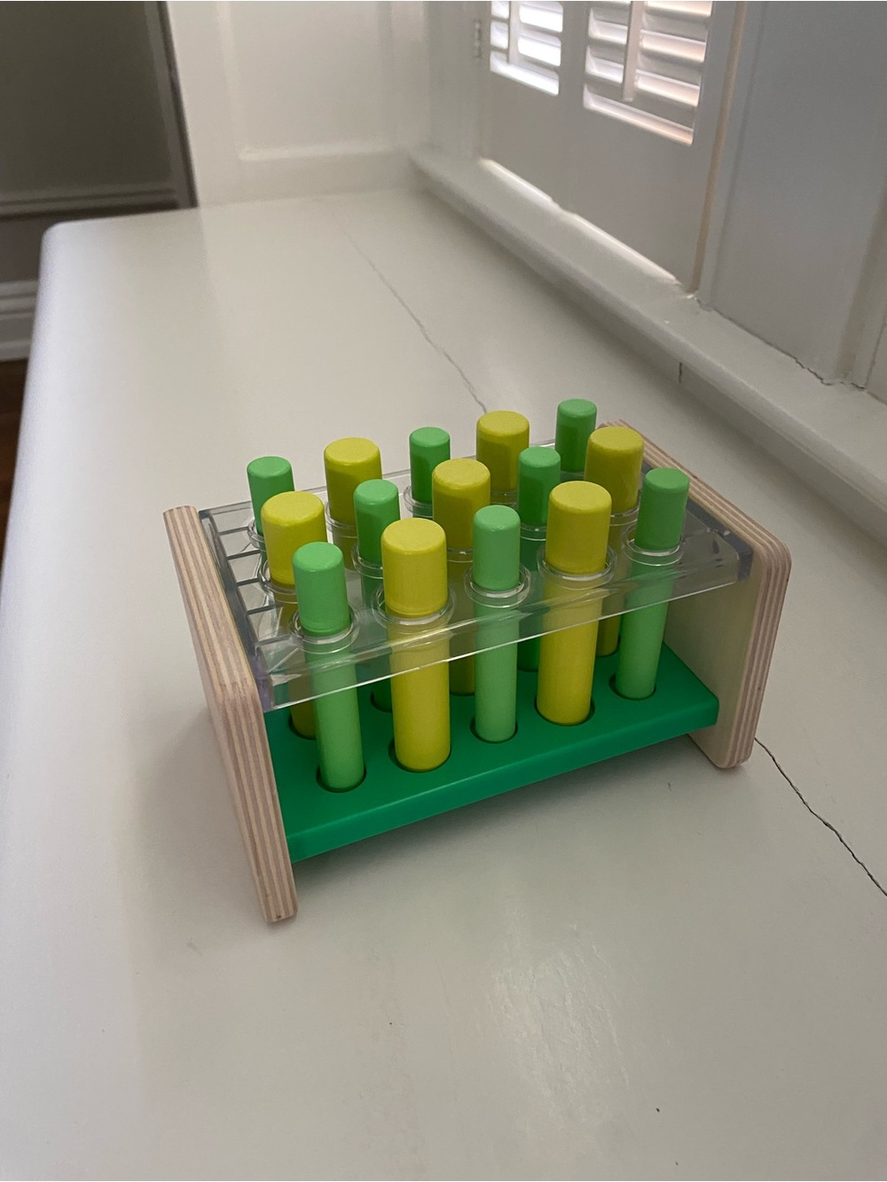 Lovevery Wooden Test Tube Toy Set in Green and Yellow